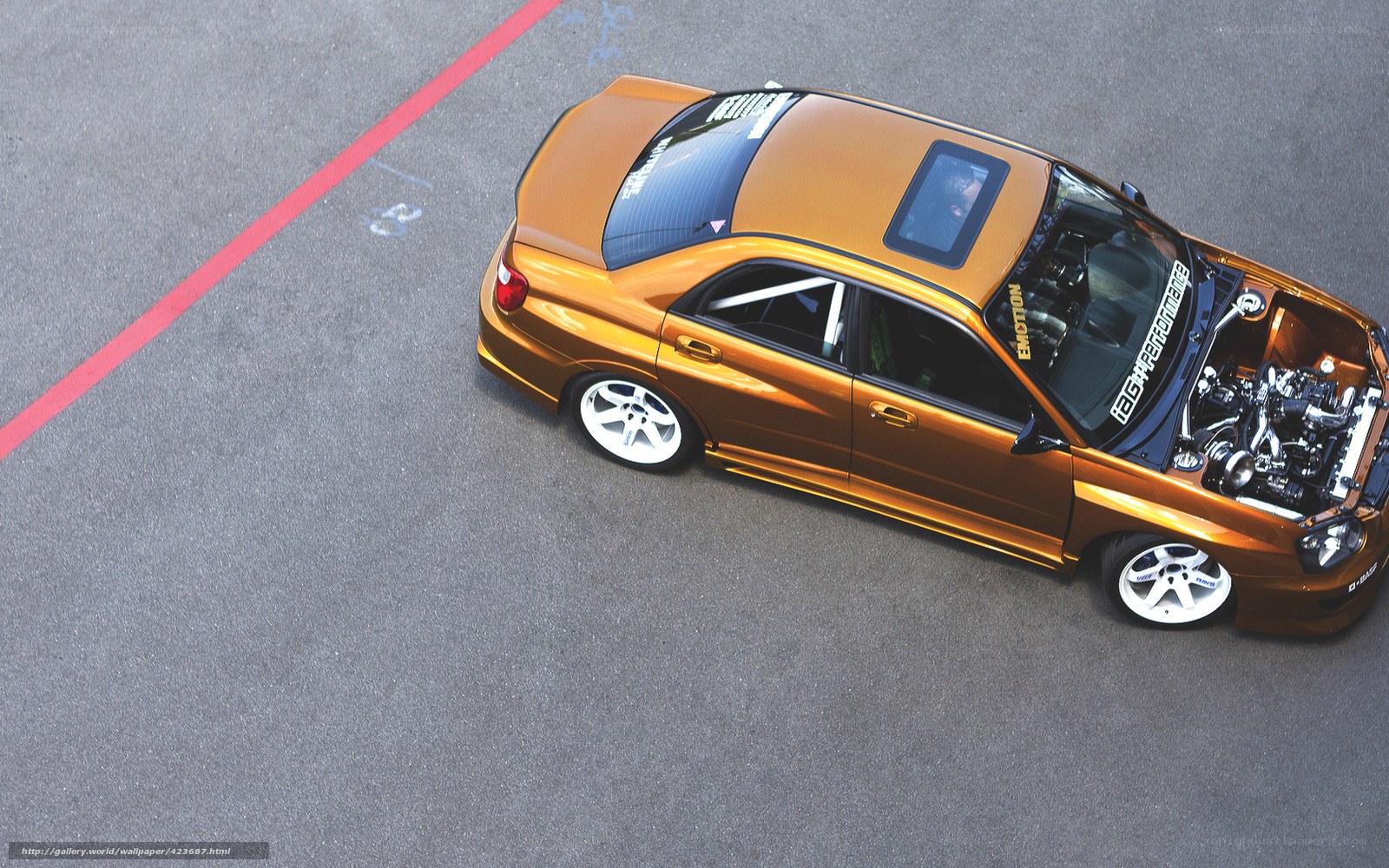 golden modified car with open hood