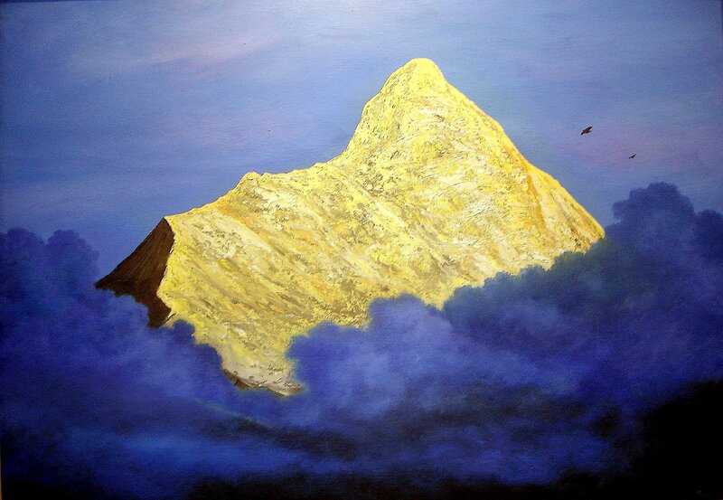 Golden mountain above clouds
