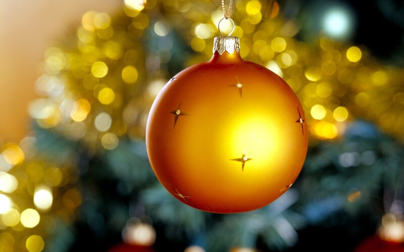 Golden ornament on Christmas tree