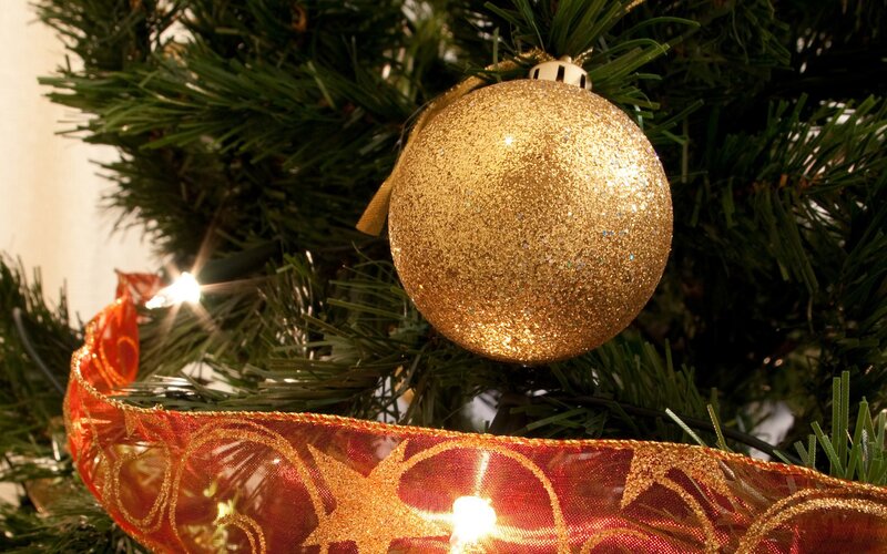 Golden ornament on Christmas tree