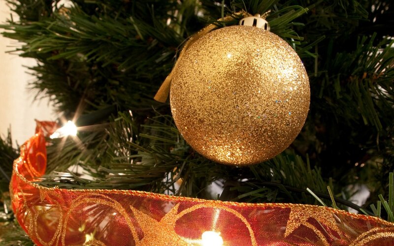 Golden ornament on Christmas tree