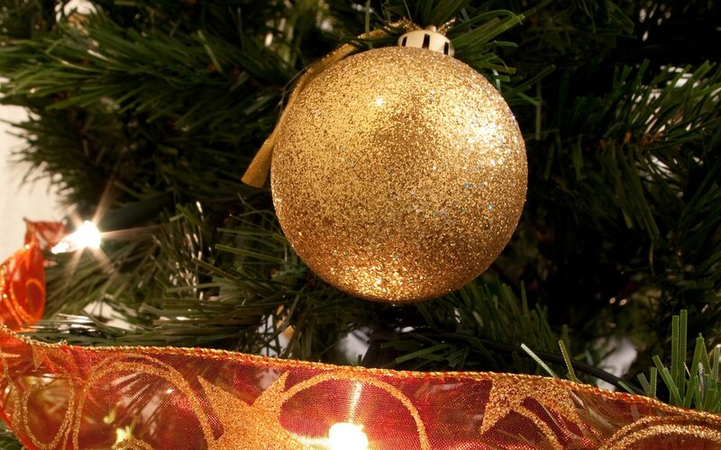 Golden ornament on Christmas tree