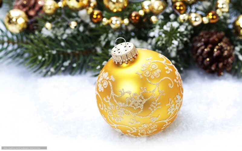 Golden ornament on snow