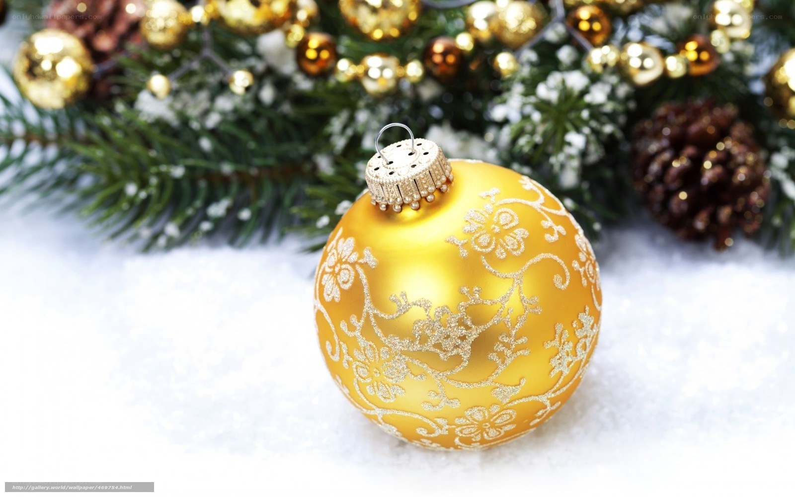 Golden ornament on snow