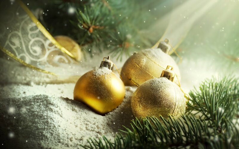 Golden ornaments in snow