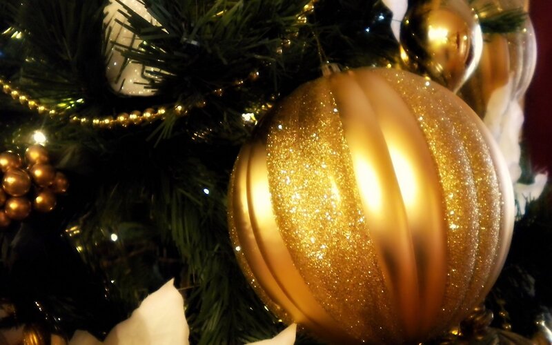 Golden ornaments on a Christmas tree