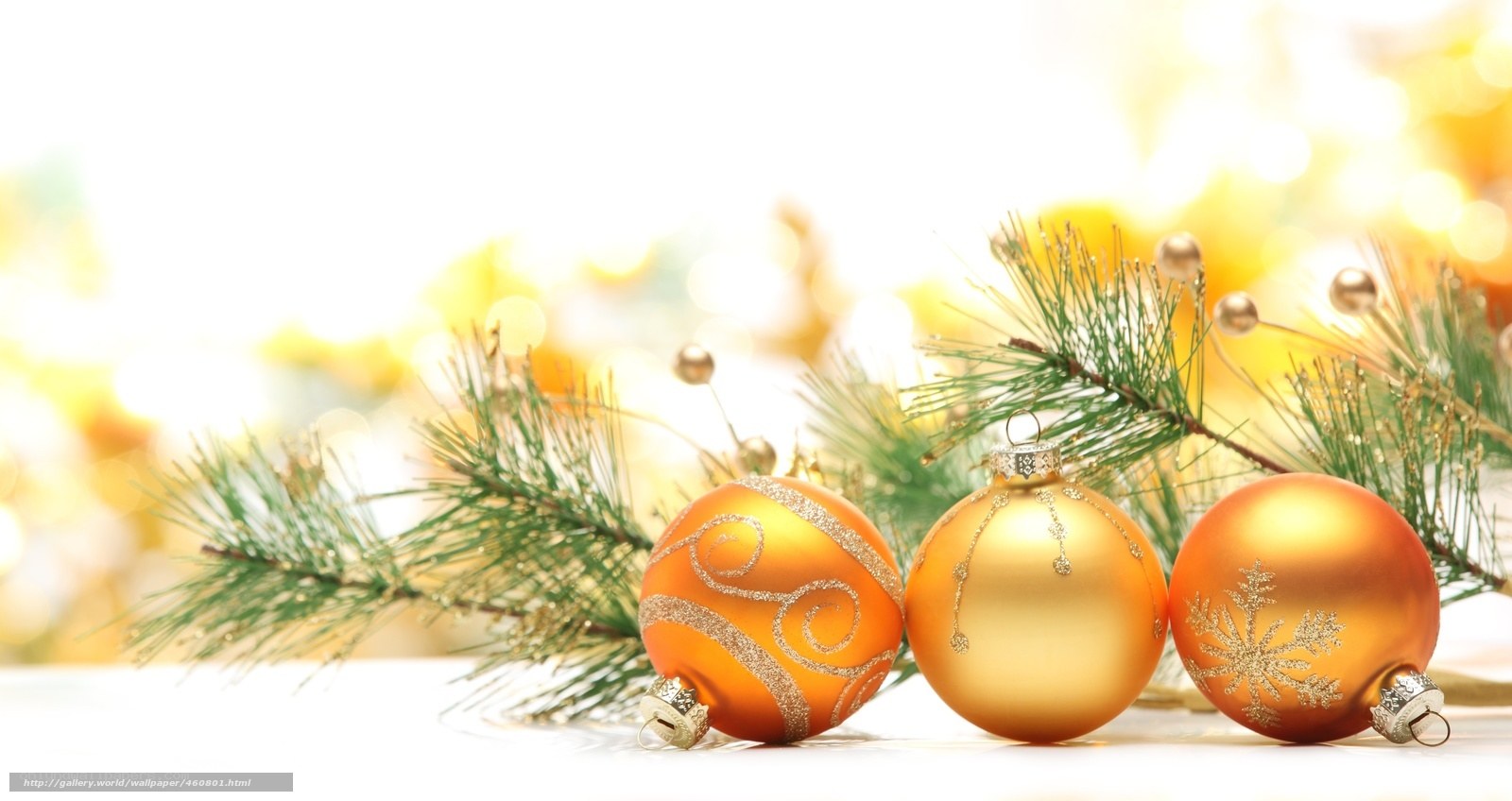 Golden ornaments on pine branches