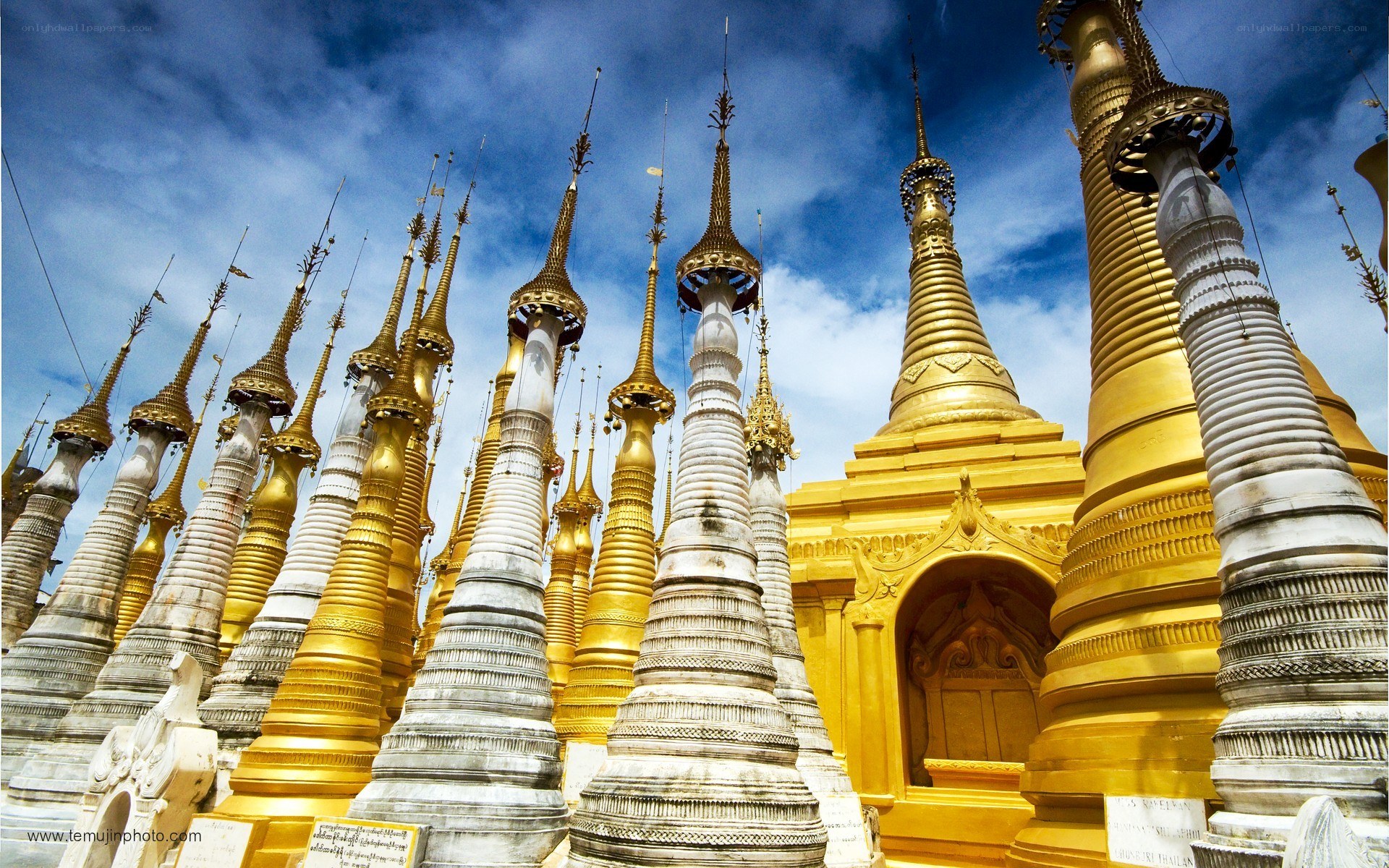 Golden pagodas under blue sky