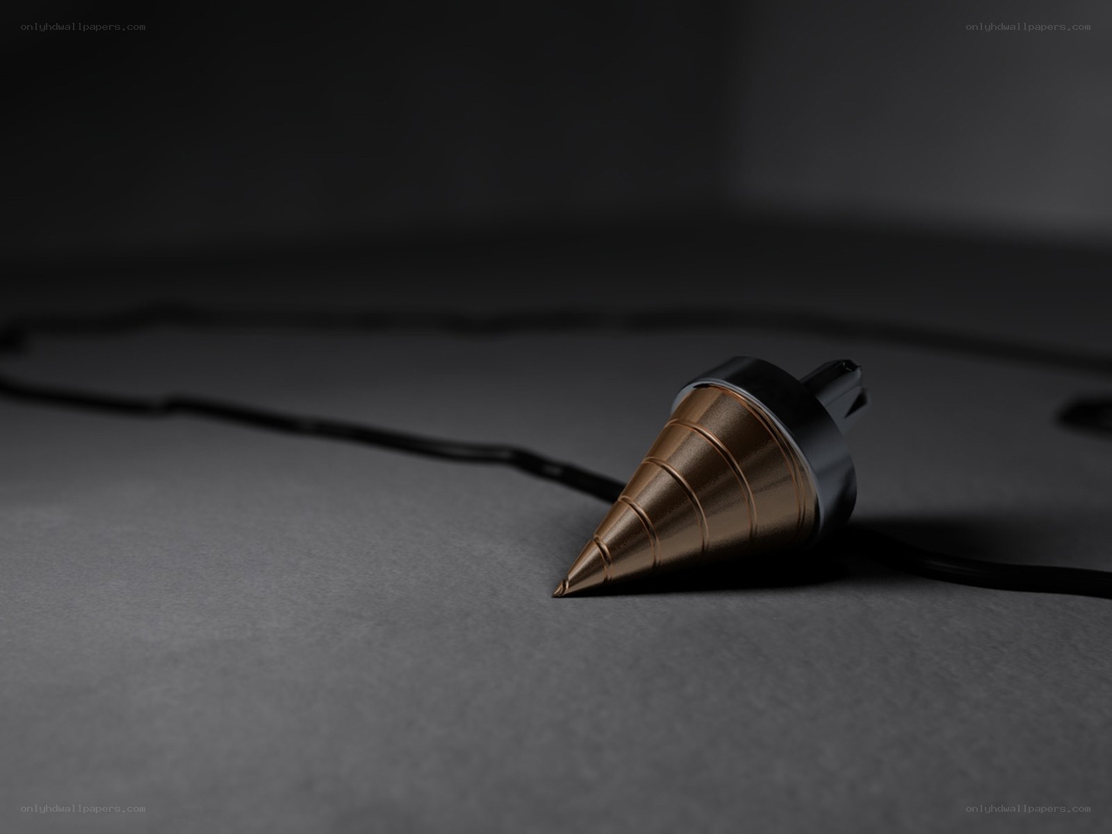 golden pendulum on dark surface
