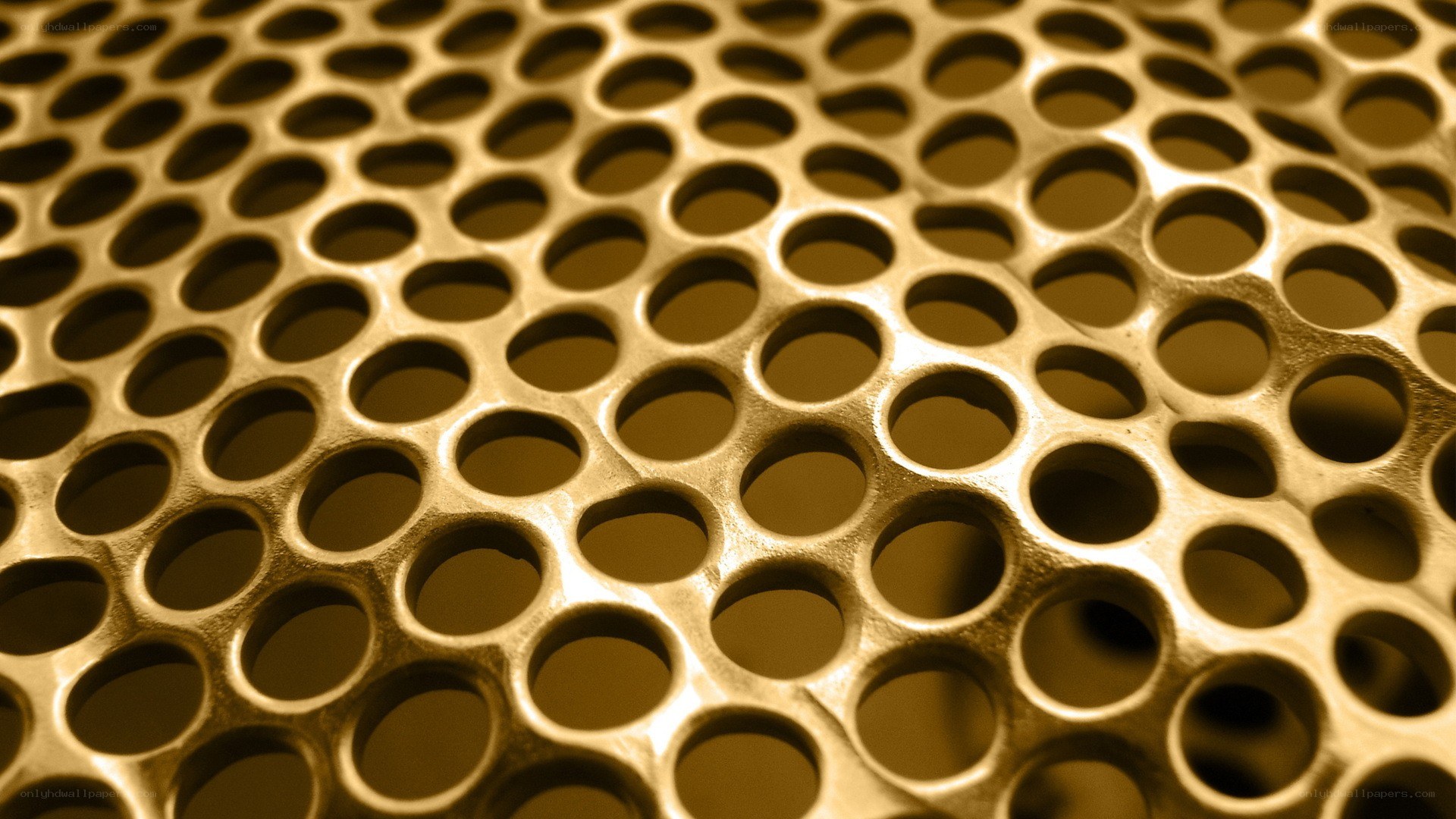 golden perforated metal surface