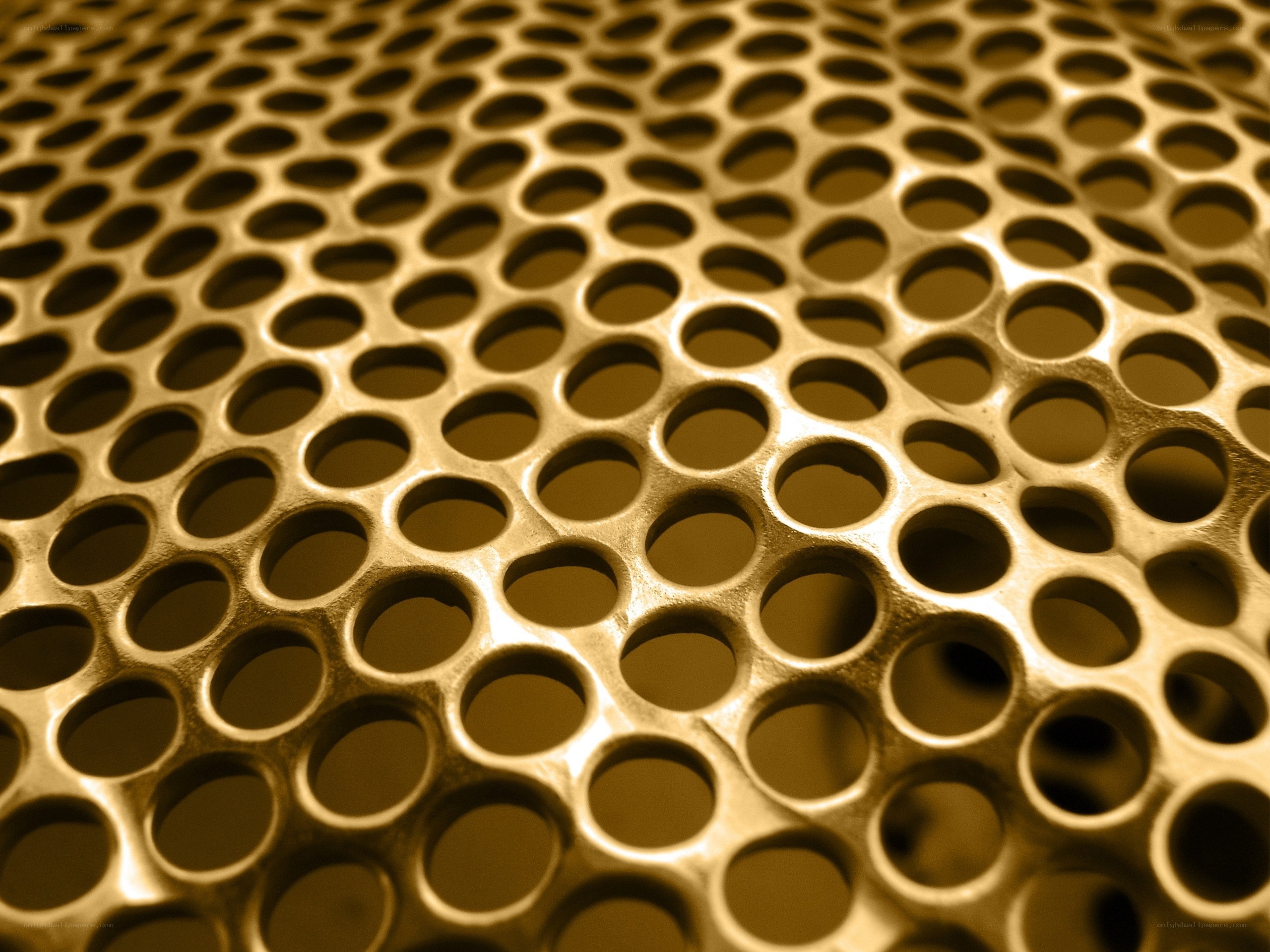 golden perforated metal surface