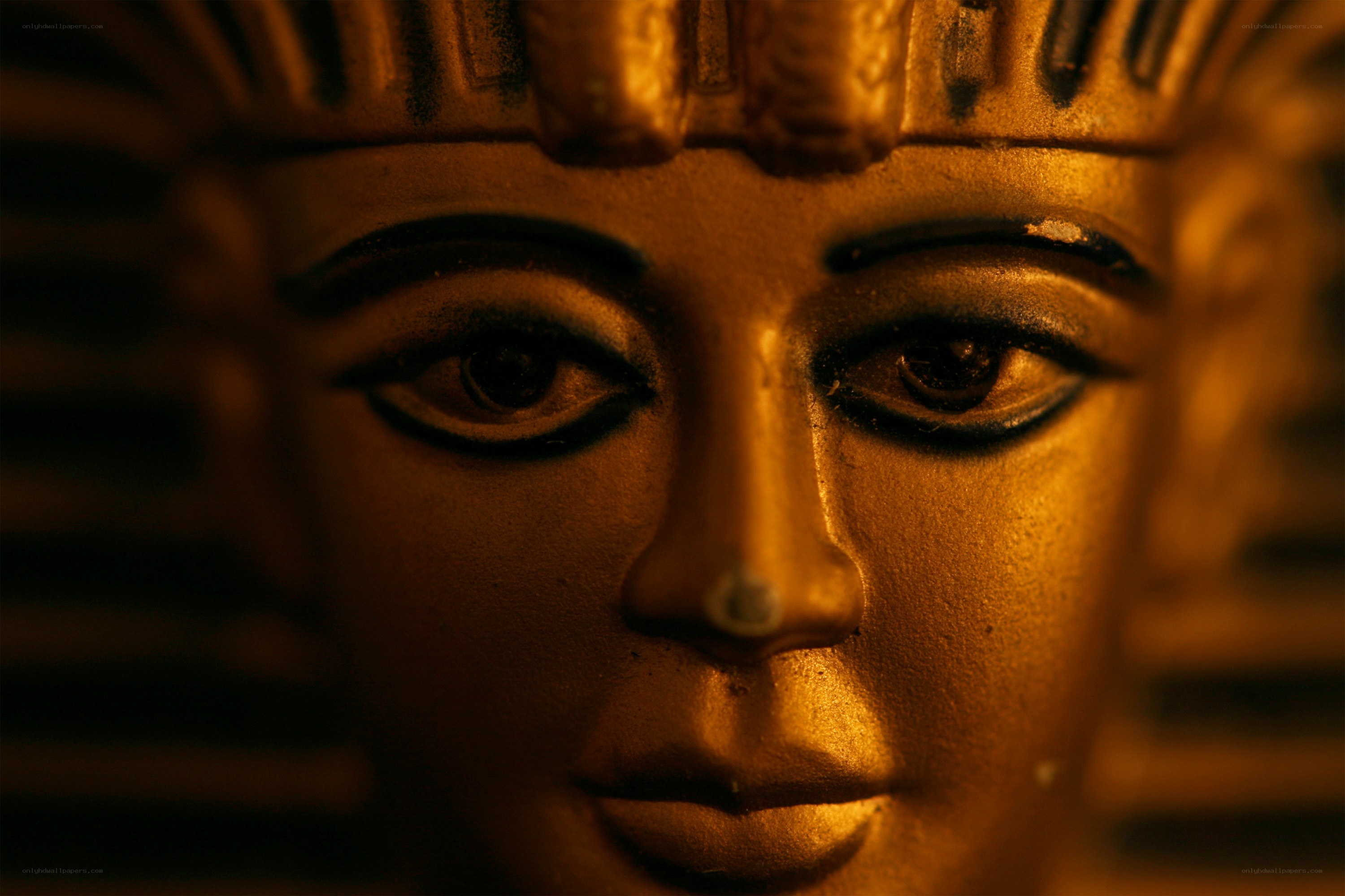 golden pharaoh statue close-up