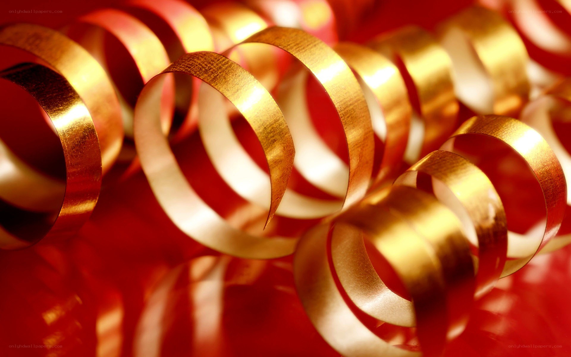 golden ribbons on red background
