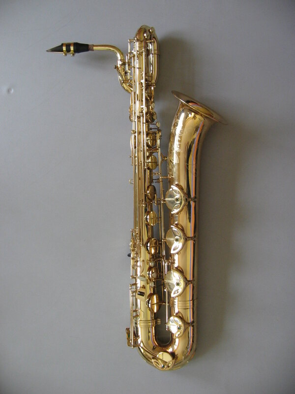 golden saxophone on gray wall