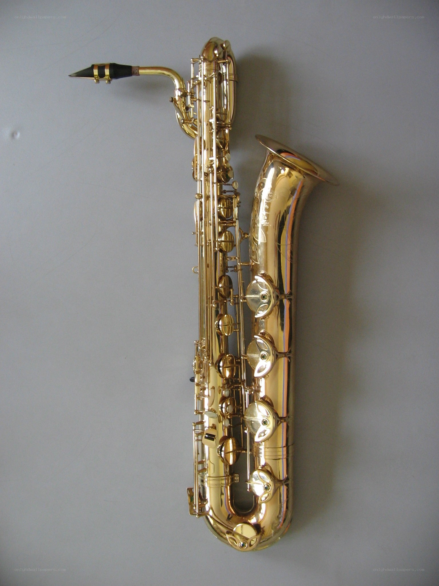 golden saxophone on gray wall
