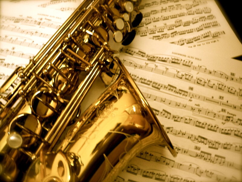 Golden Saxophone on Sheet Music — Gold
