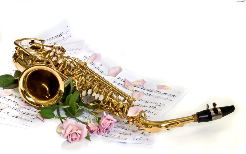 Golden Saxophone on Sheet Music