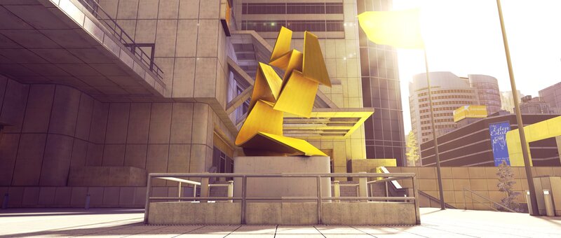 Golden sculpture in city plaza