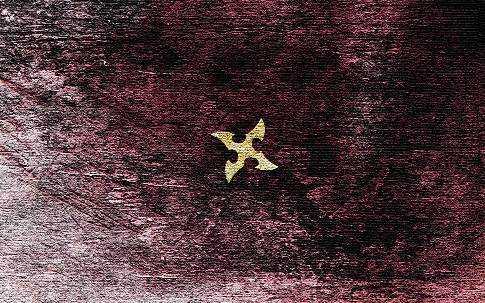 Golden shuriken on dark background