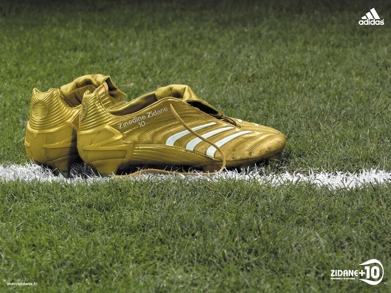 golden soccer cleats on field