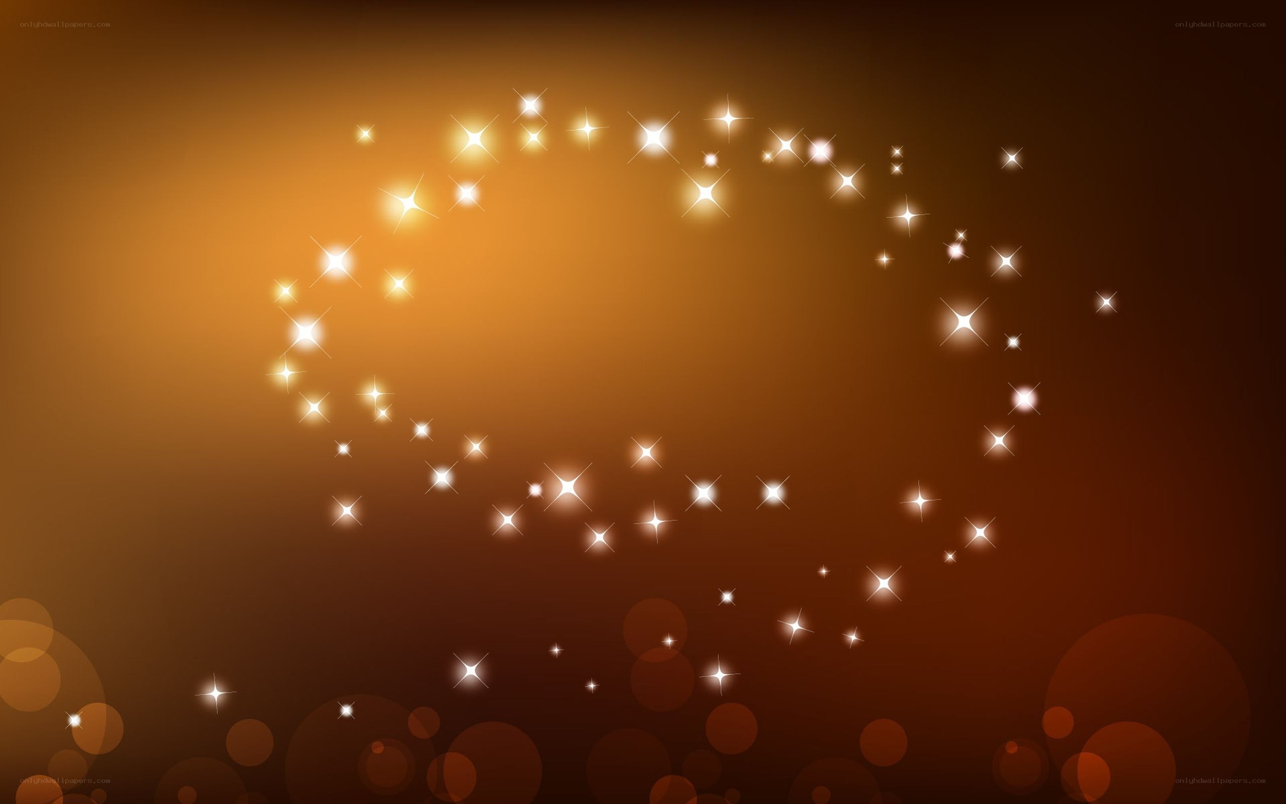 golden sparkles on brown background