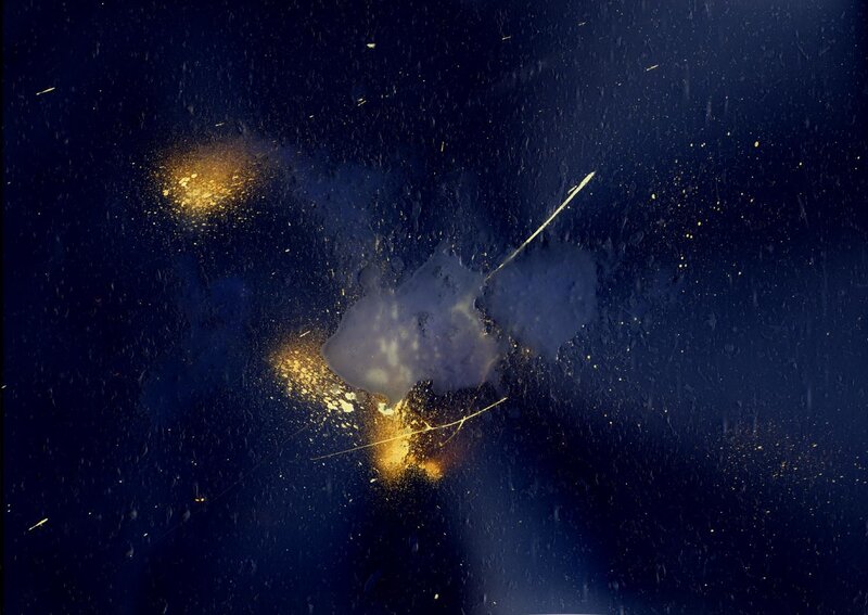 Golden splatters on dark surface