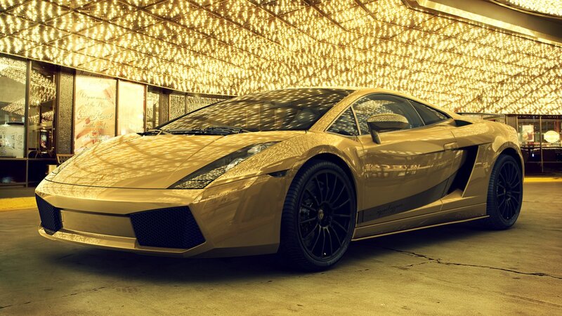 golden sports car at night