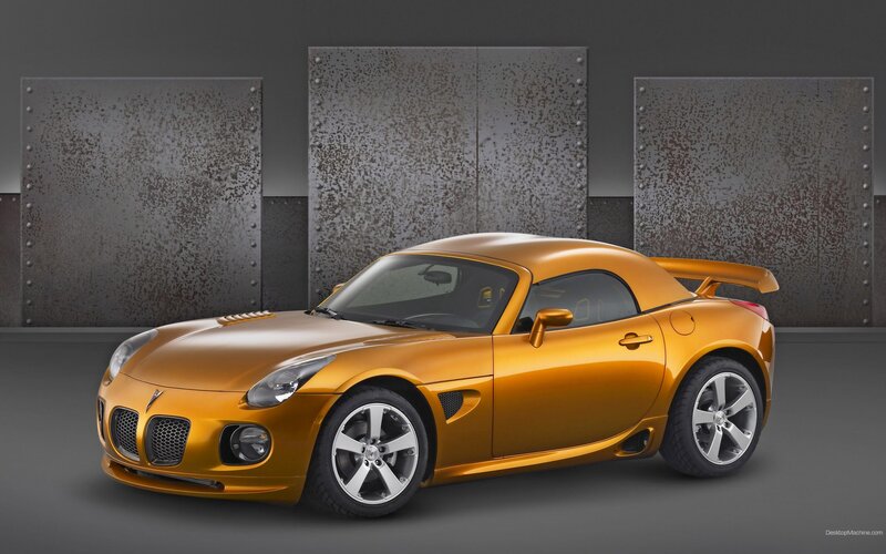 golden sports car in studio