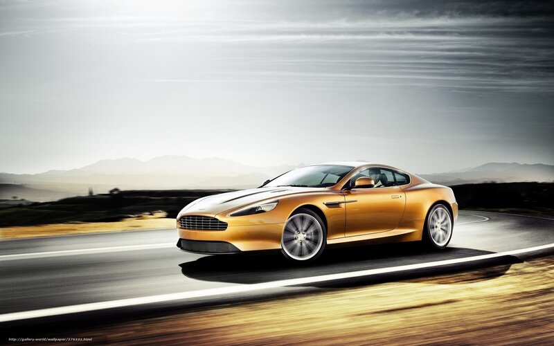 golden sports car on road