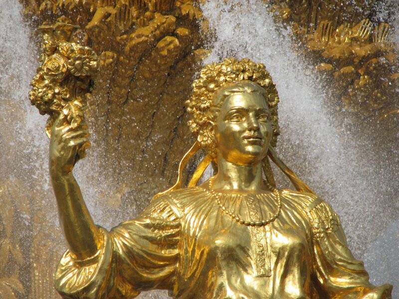 Golden statue at a fountain
