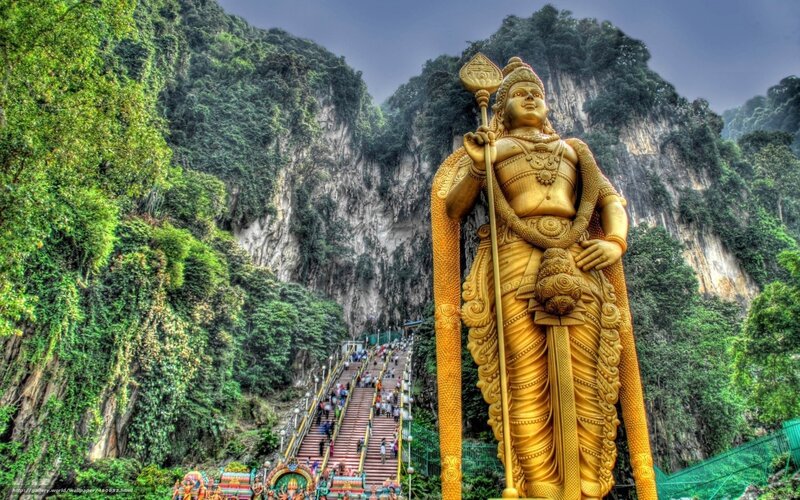 Golden Statue of Murugan — Gold, Dramatic, Afternoon, Photograph