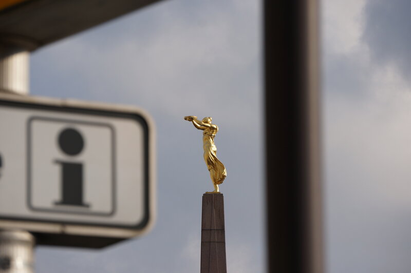 Golden Statue on Pedestal — Gold, Serene