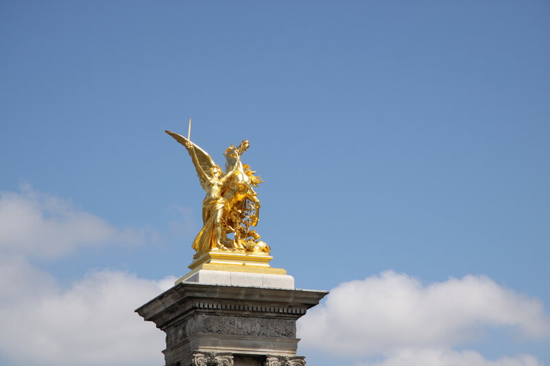 Golden Statue on Pedestal — Gold