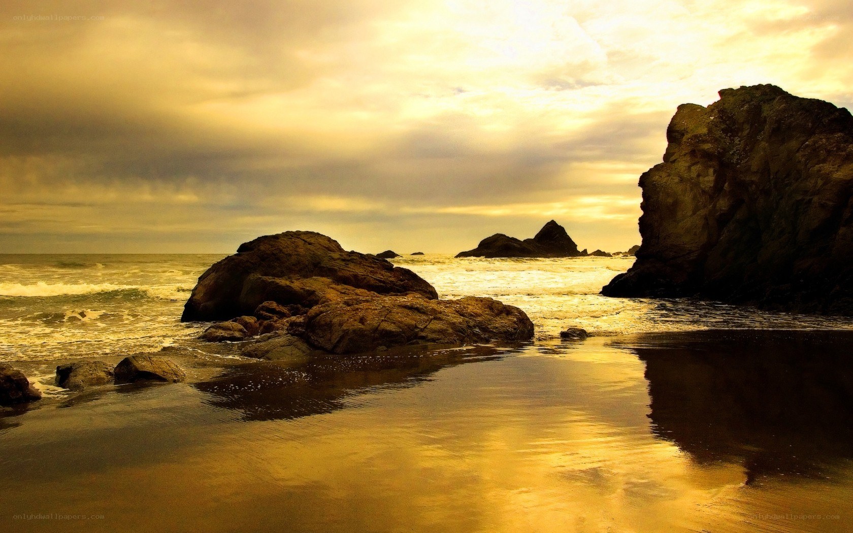 Golden sunset at rocky beach