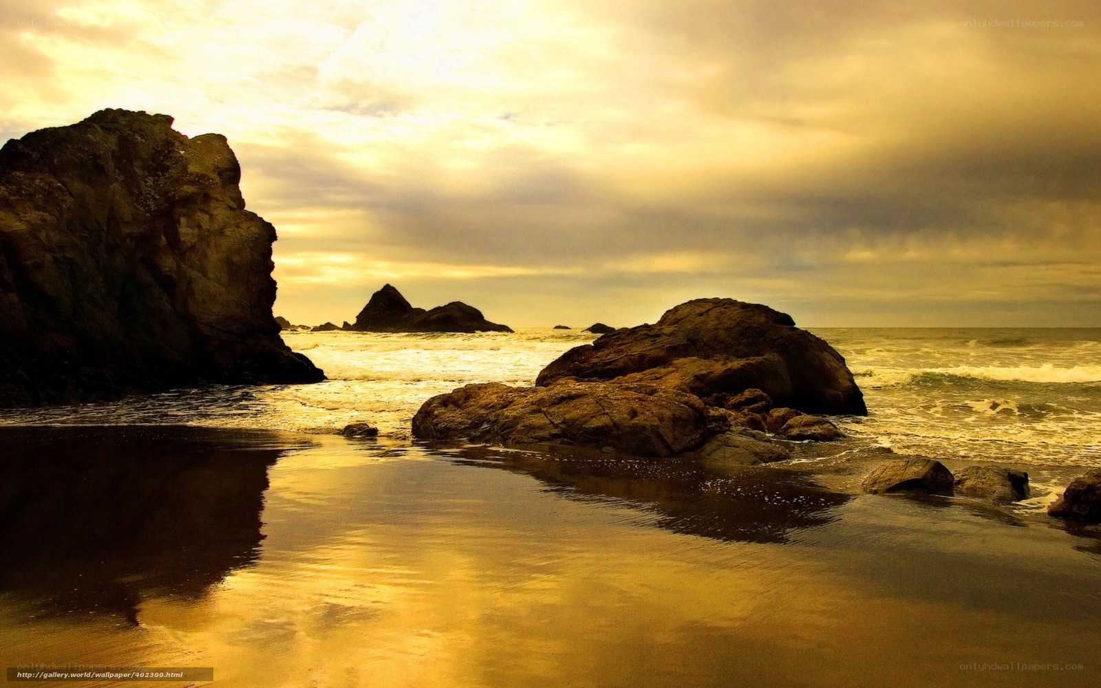 Golden sunset at rocky beach