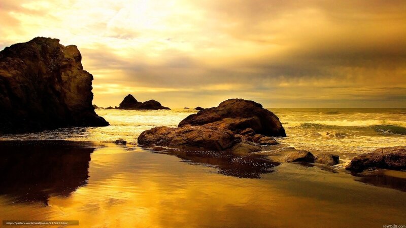 Golden sunset at the rocky shore