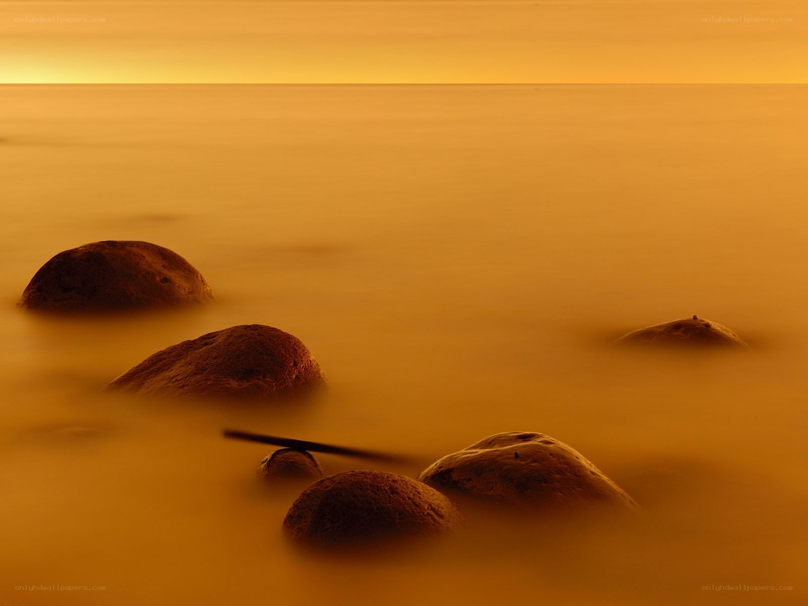 Golden sunset over calm sea