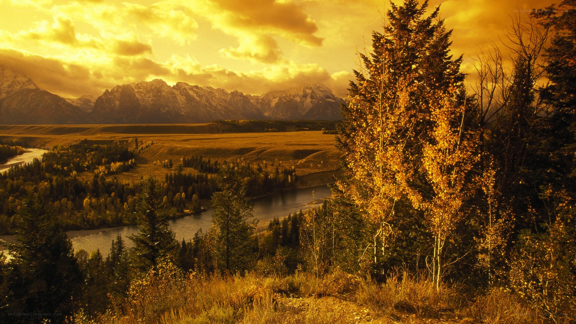 Golden sunset over mountain valley