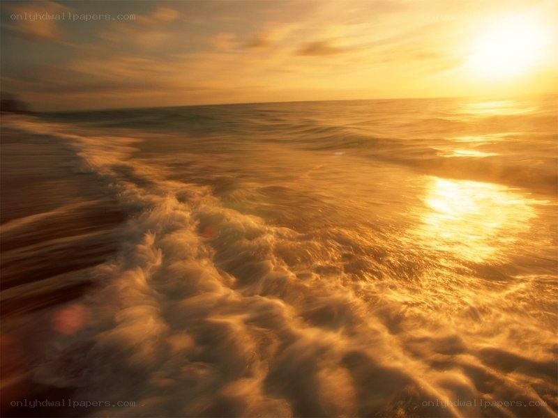golden sunset over ocean waves