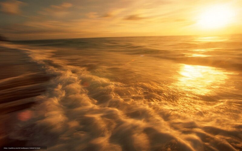 Golden sunset over ocean waves
