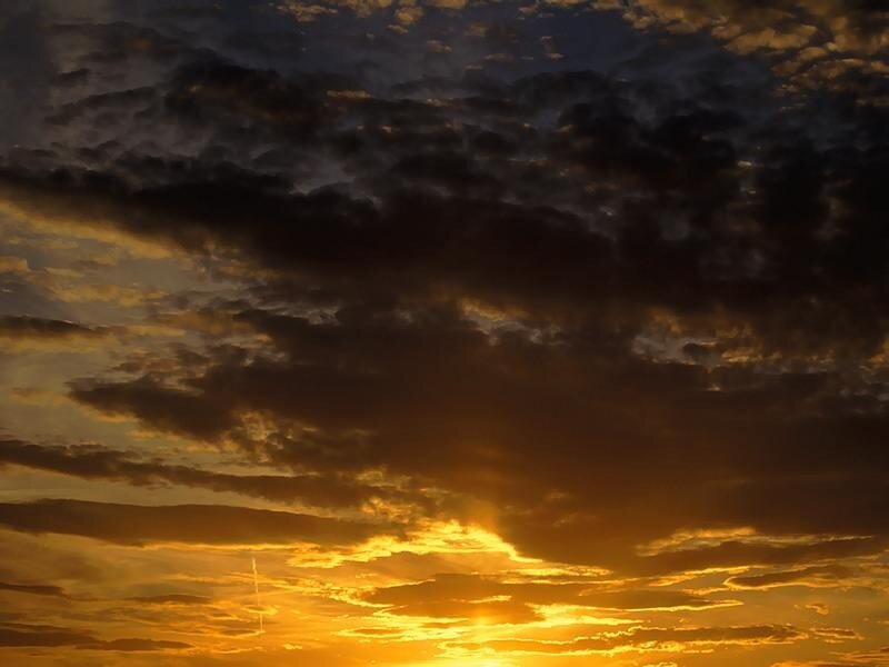 Golden sunset with dark clouds