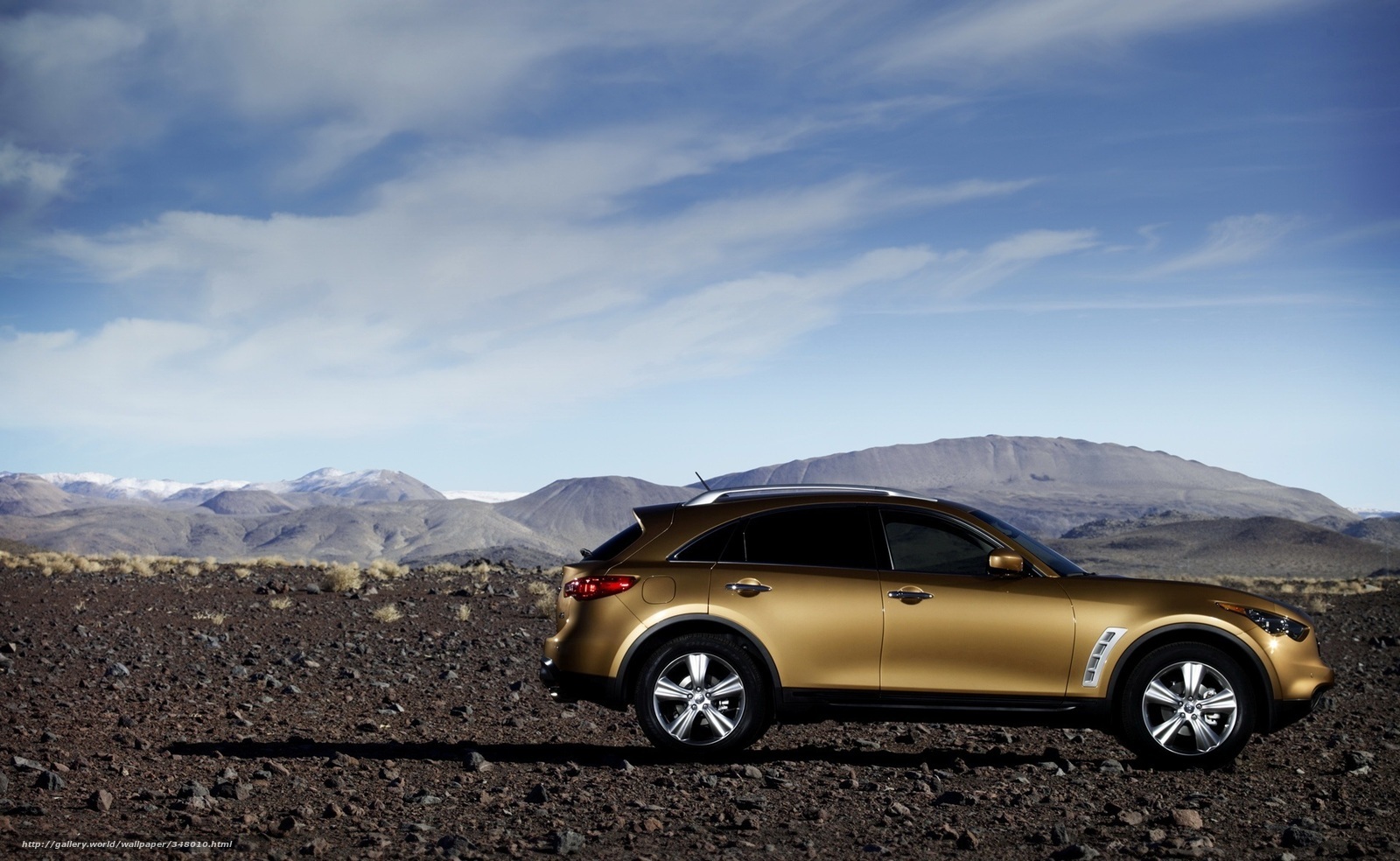 golden SUV in desert landscape