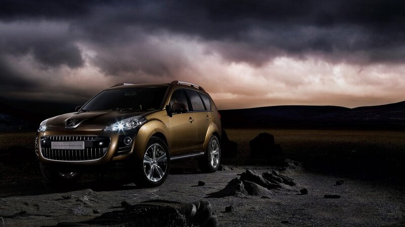 Golden SUV in dramatic landscape