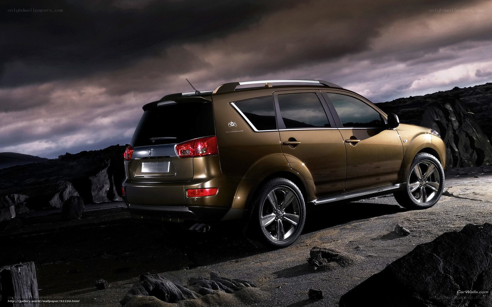 golden SUV on rocky terrain
