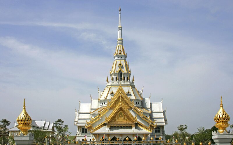 Golden temple with white spire