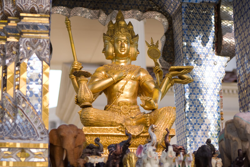 Golden three-headed deity statue