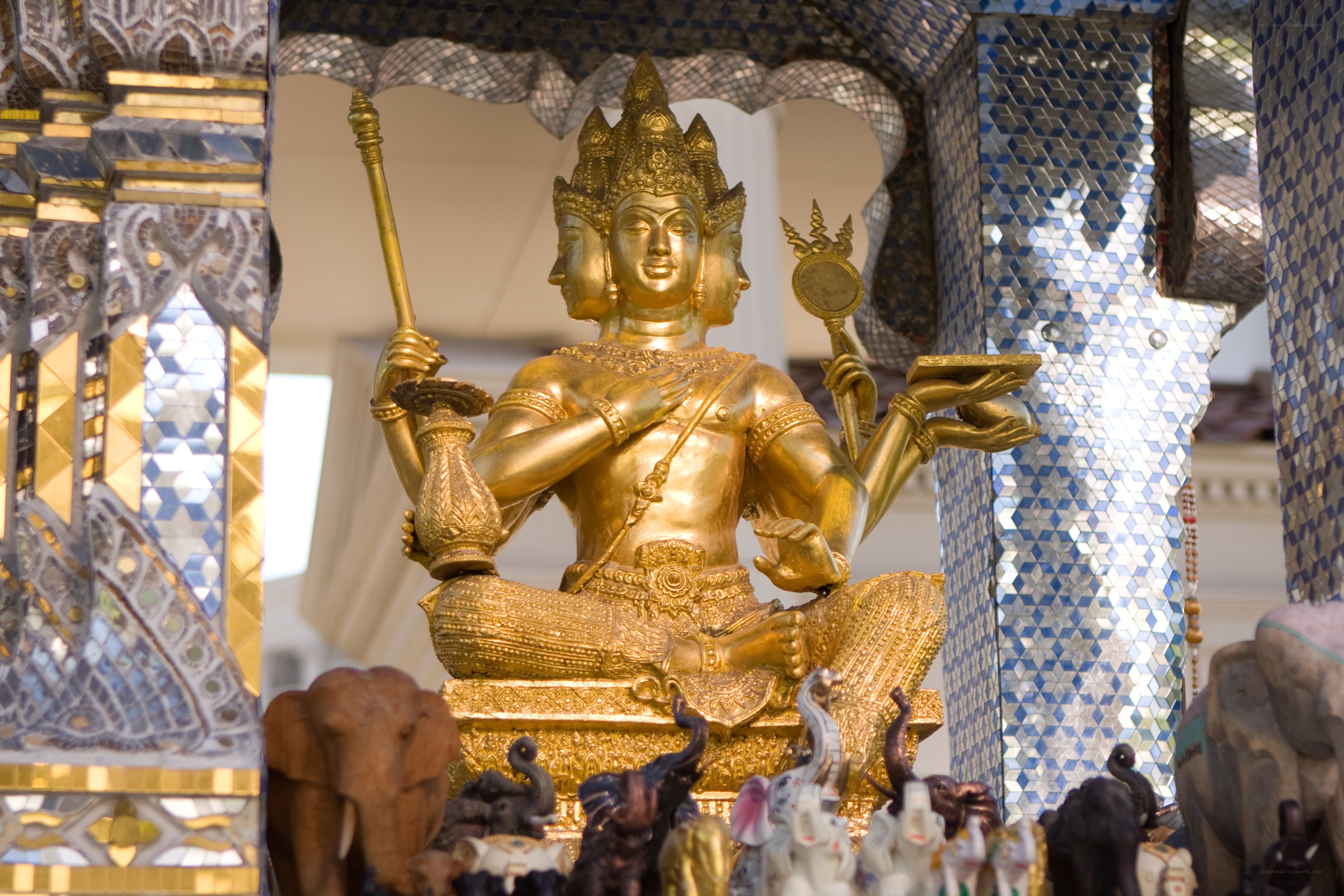 Golden three-headed deity statue