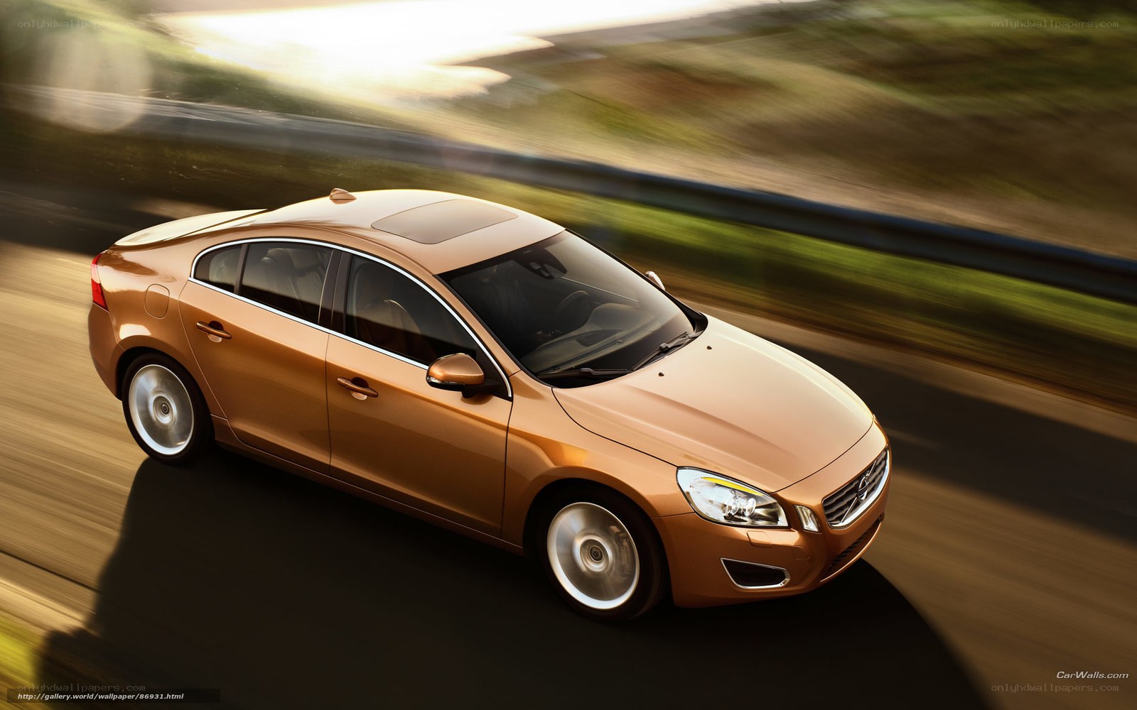 golden volvo in motion