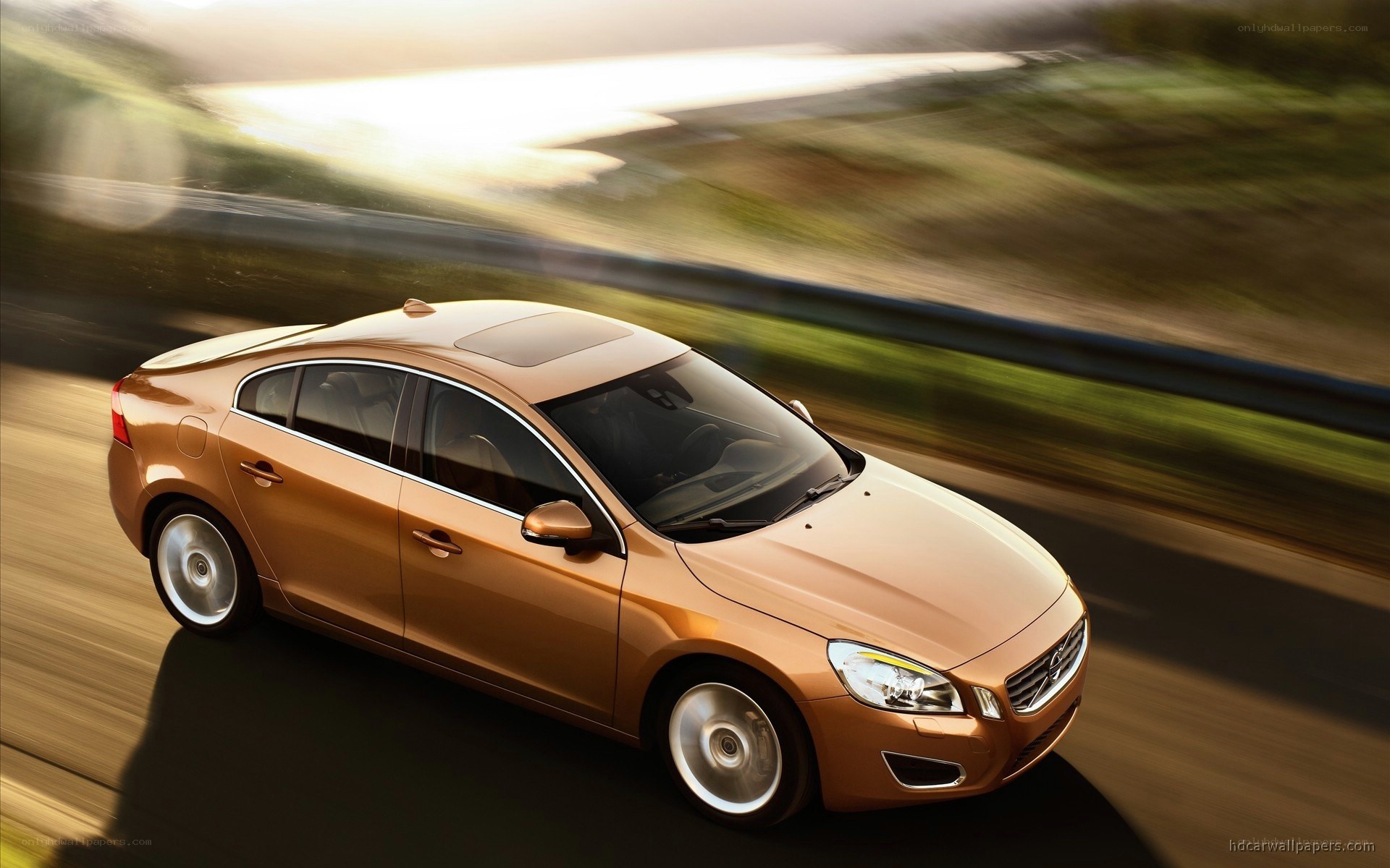 golden volvo on a road