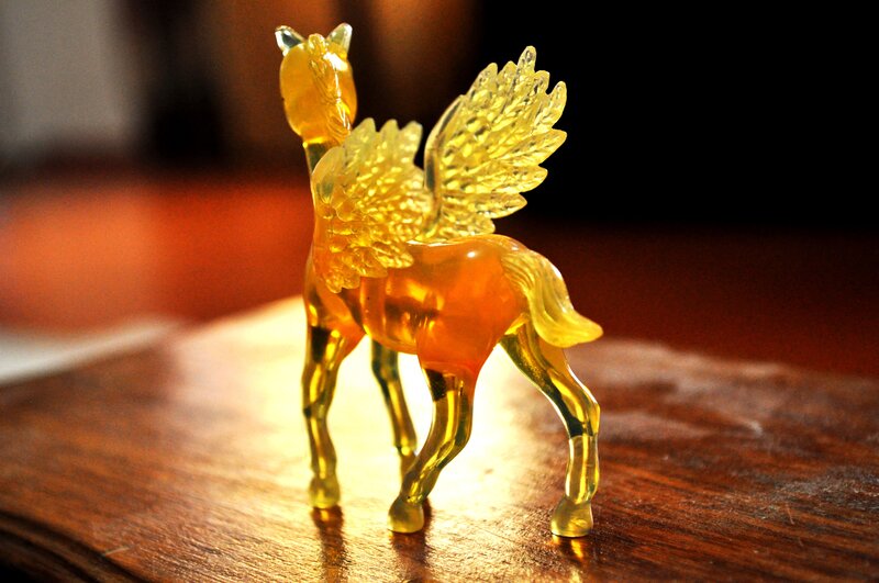 Golden winged horse figurine